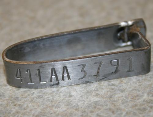 metal nues tag with numbers and letters imprinted, metallic color