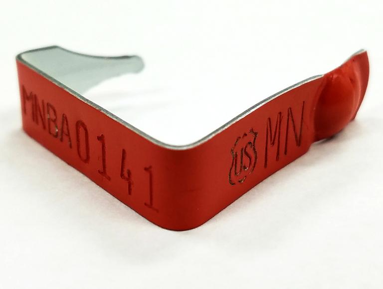 red metal band with id number imprinted